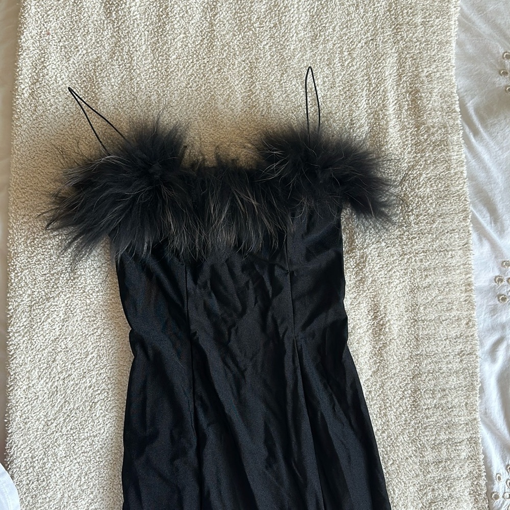 Black midi dress with front leg slit and fun top.
